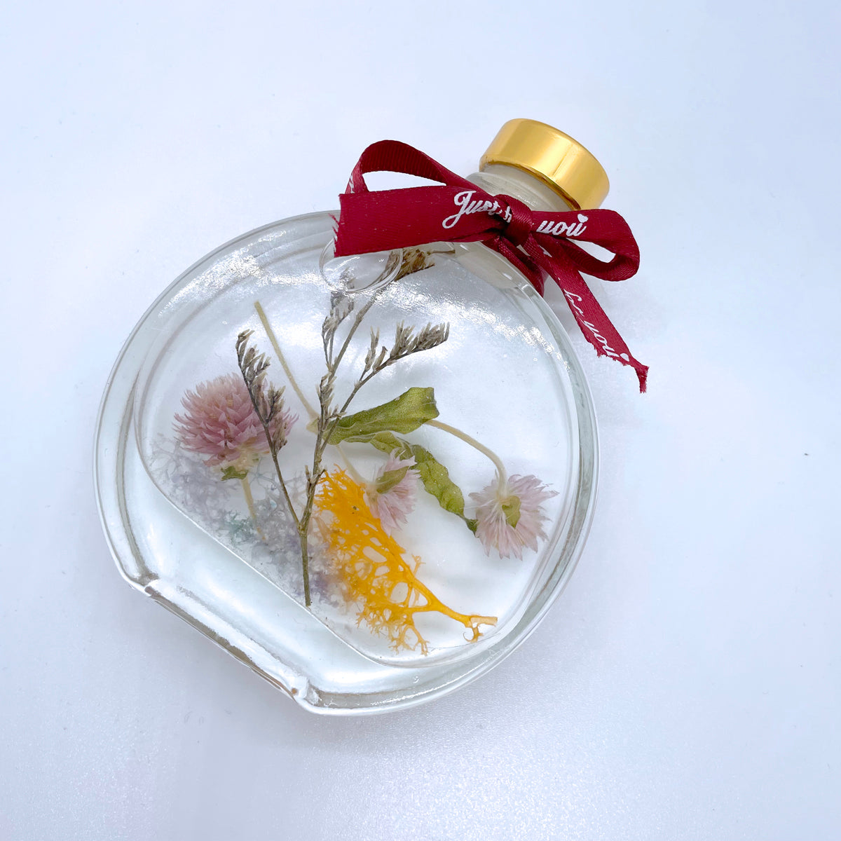Floating flowers in clear and mixed colors (small round bottle shape)