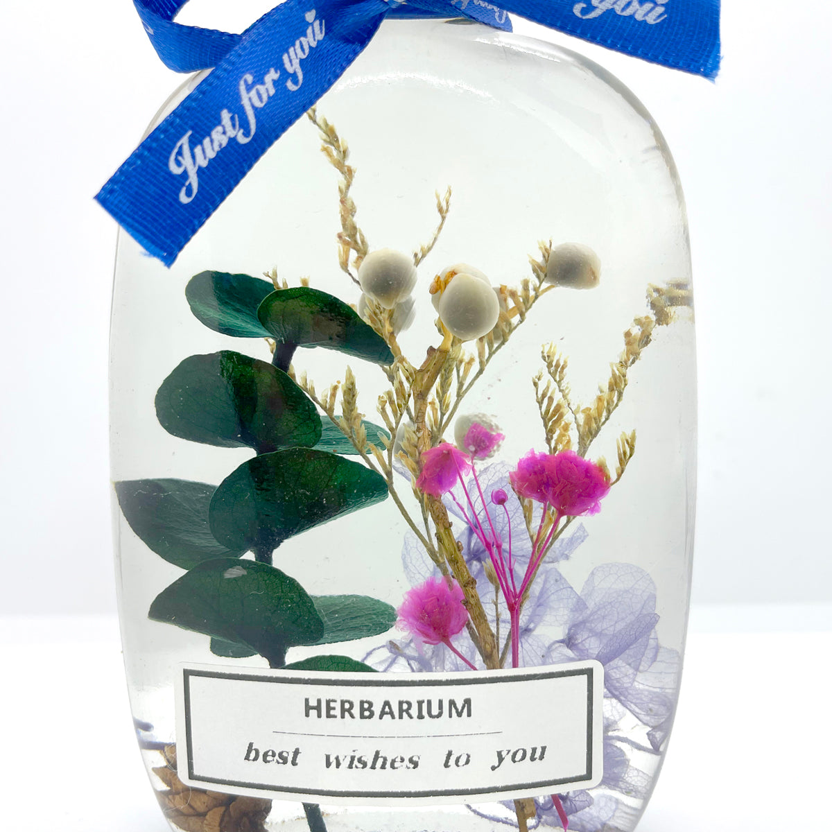 Floating flowers in clear and complex colors (in the shape of a flat arc bottle)