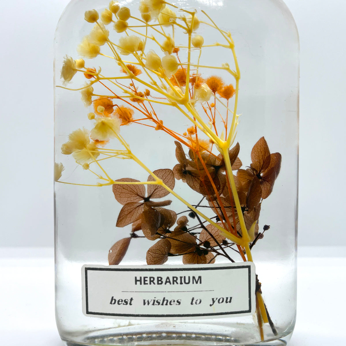 Clear yellow brown pink floating flowers (whiskey glass bottle)