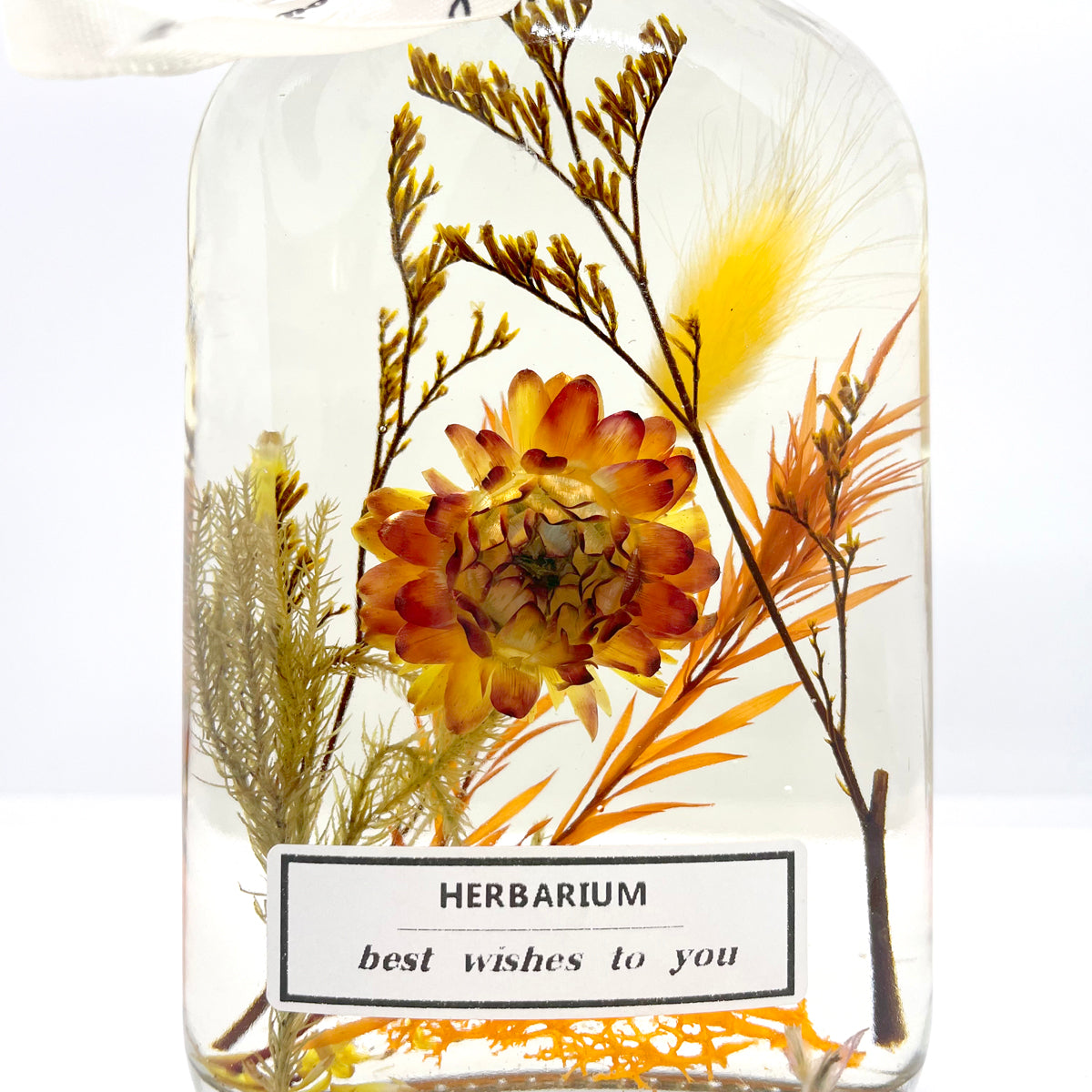 Clear yellow floating flowers (whiskey glass bottle shape)
