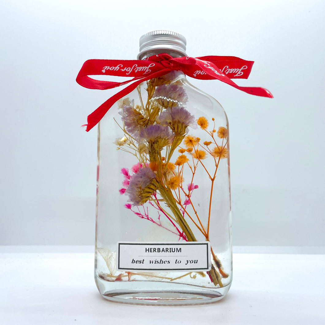 Clear purple yellow pink floating flowers (whiskey glass bottle)