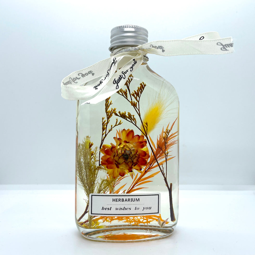 Clear yellow floating flowers (whiskey glass bottle shape)