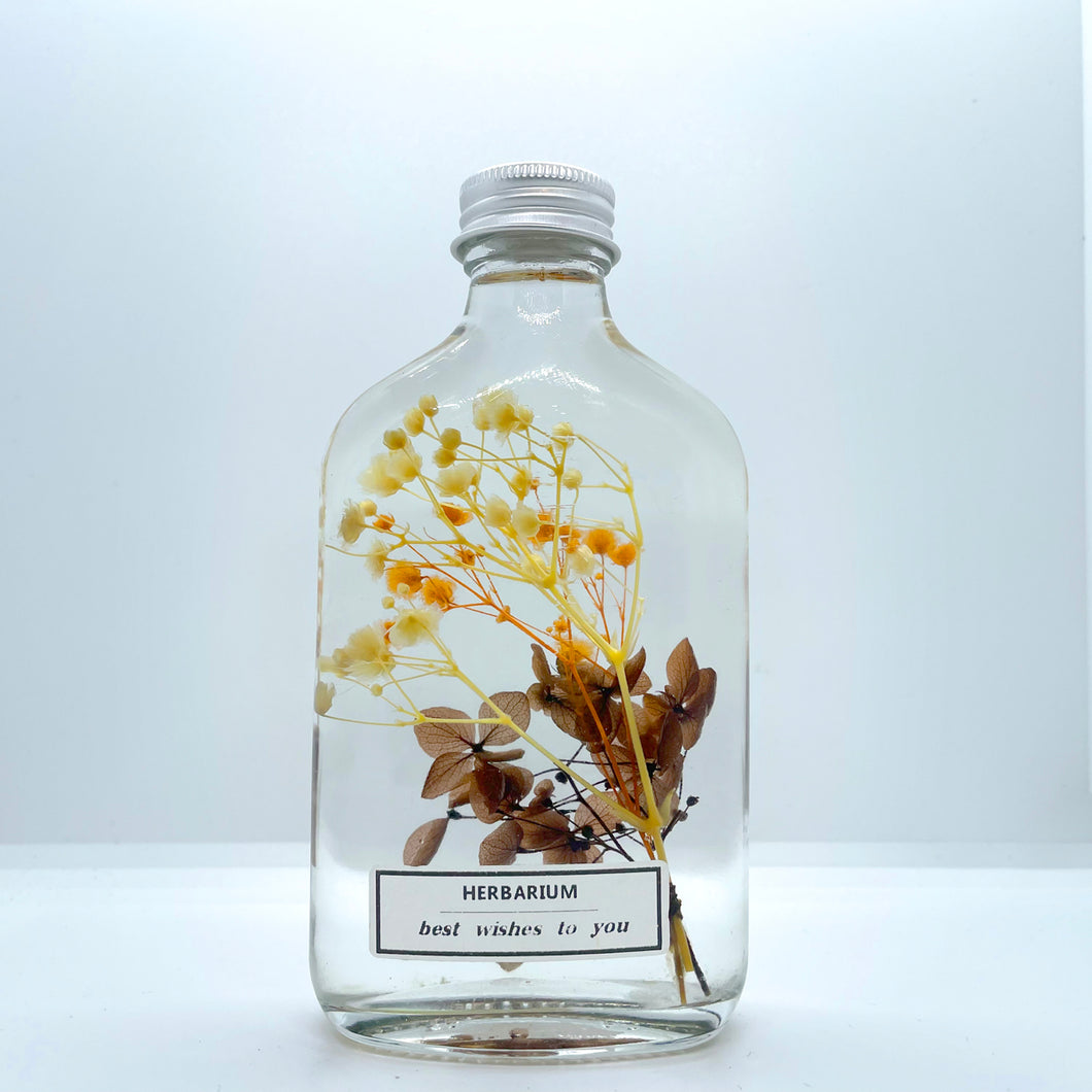 Clear yellow brown pink floating flowers (whiskey glass bottle)